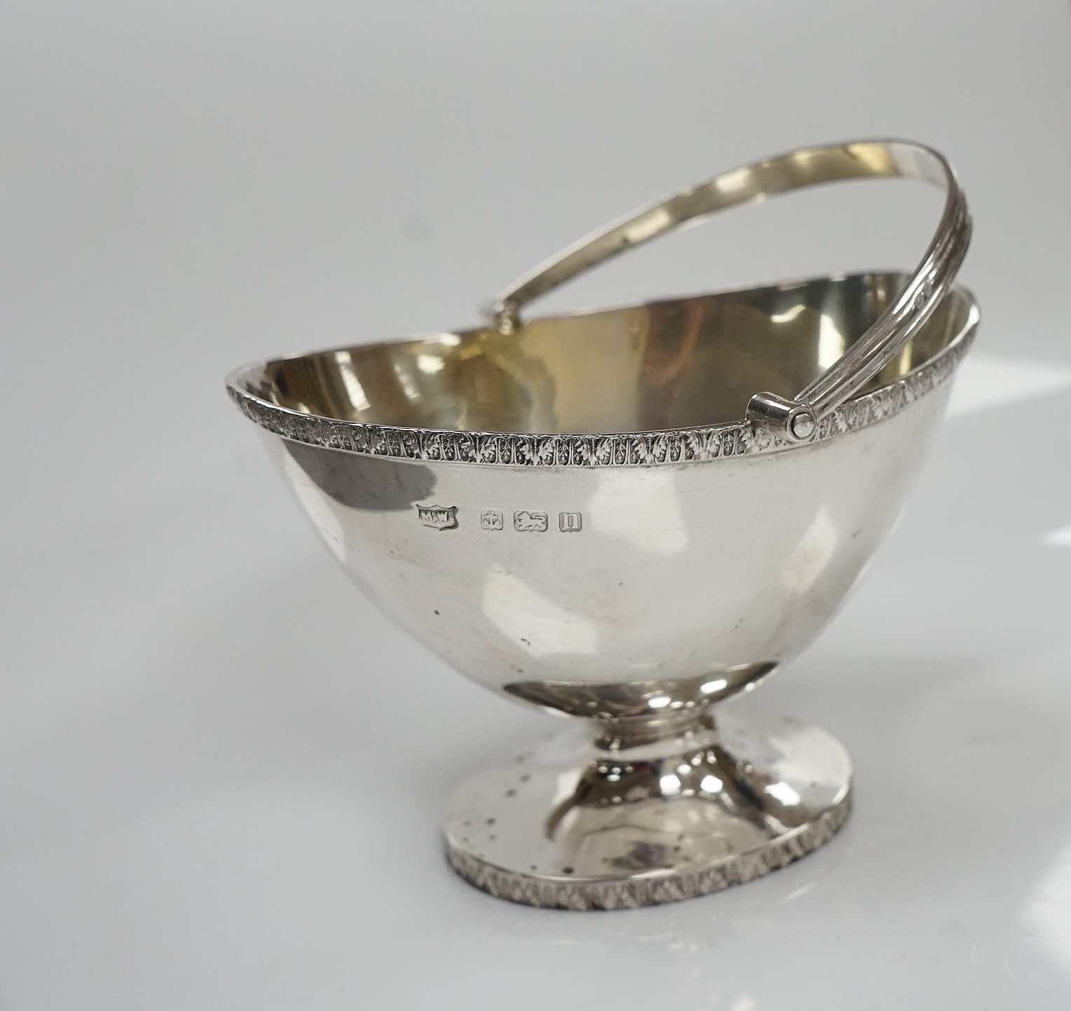 A George V silver oval sugar basket, Mappin & Webb, Birmingham, 1912, length 12.5cm, 6.2oz. Condition - fair